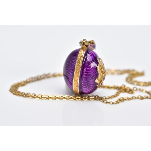 61 - A SILVER GILT PENDANT NECKLET, the pendant in the form of an egg with purple guilloche enamel and a ... 