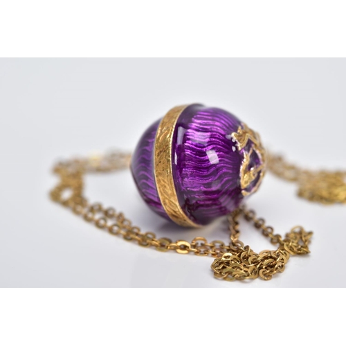 61 - A SILVER GILT PENDANT NECKLET, the pendant in the form of an egg with purple guilloche enamel and a ... 