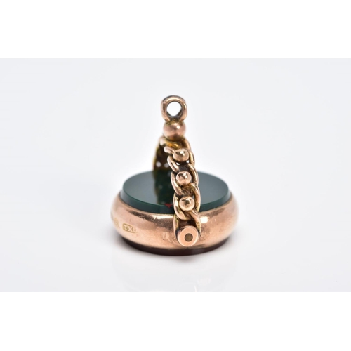 62 - A 9CT GOLD SWIVEL FOB, of circular design swivels to reveal bloodstone and carnelian panels, to a be... 