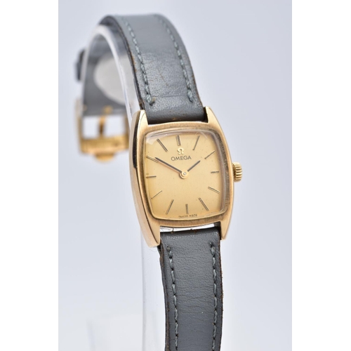 63 - A LADIES 9CT GOLD OMEGA WRISTWATCH, of a square shape, gold tone dial signed 'Omega', baton markers,... 