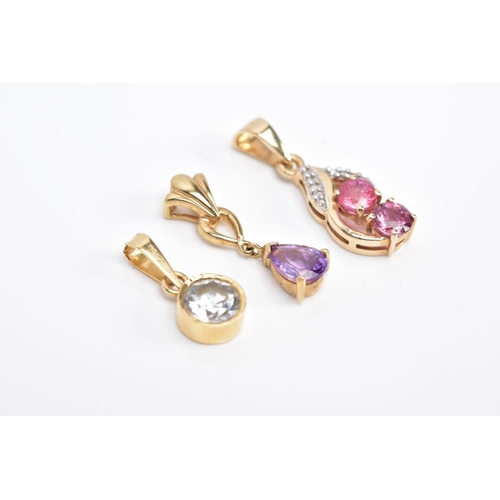 64 - THREE YELLOW METAL GEM SET PENDANTS, the first a drop set with two circular cut pink sapphires with ... 