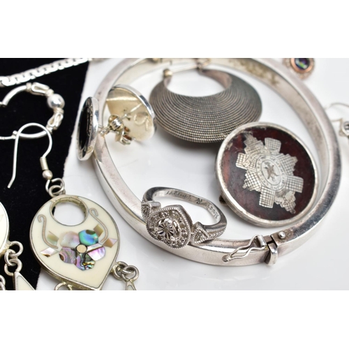 67 - A SELECTION OF WHITE METAL JEWELLERY, to include a white metal ring of heart shape set with single c... 