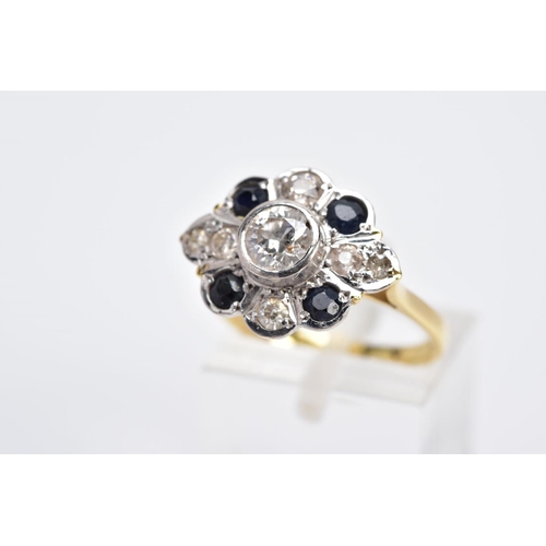 1 - A YELLOW METAL DIAMOND AND SAPPHIRE RING, designed with a central early brilliant cut diamond in a c... 