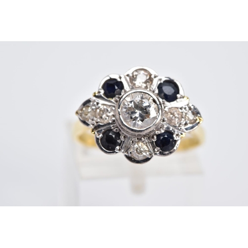 1 - A YELLOW METAL DIAMOND AND SAPPHIRE RING, designed with a central early brilliant cut diamond in a c... 