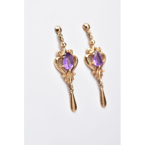 12 - A PAIR OF AMETHYST DROP EARRINGS, each yellow metal earring designed with an openwork scroll drop se... 