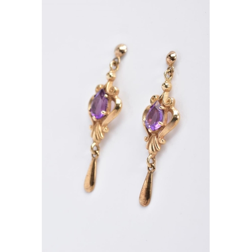 12 - A PAIR OF AMETHYST DROP EARRINGS, each yellow metal earring designed with an openwork scroll drop se... 