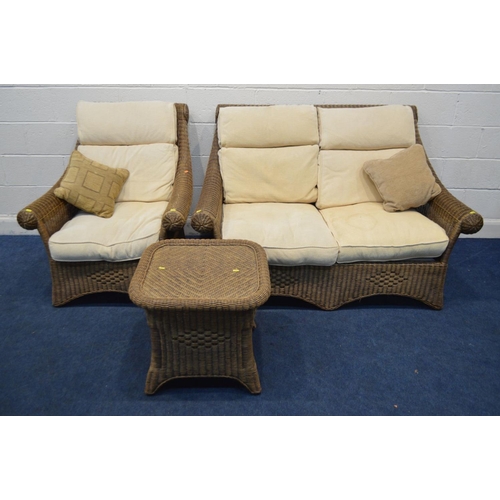 1349 - A WICKER THREE PIECE LOUNGE SUITE, with cream cushions, comprising a two seater settee, armchair and... 