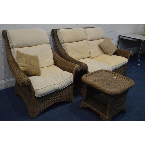 1349 - A WICKER THREE PIECE LOUNGE SUITE, with cream cushions, comprising a two seater settee, armchair and... 