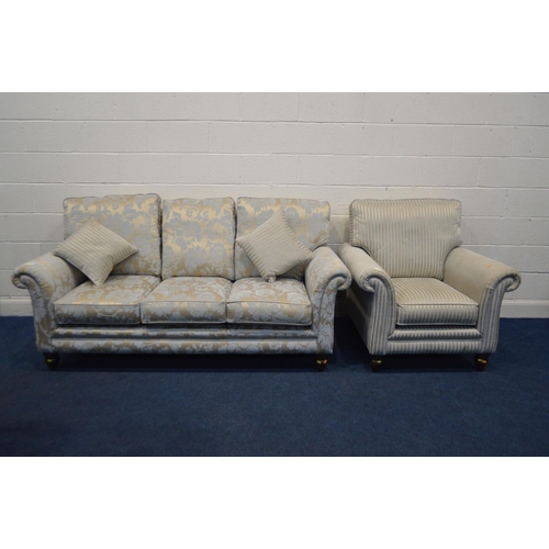 1350 - AN UPHOLSTERED TWO PIECE LOUNGE SUITE, on turned front legs, comprising a gold floral upholstered th... 