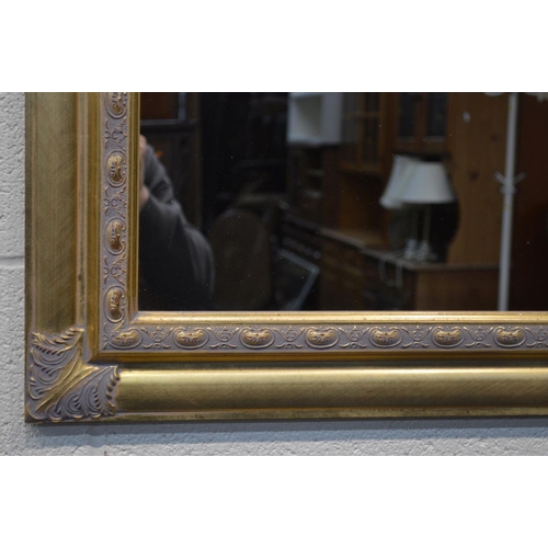 1353 - A MODERN GILT FRAMED WALL MIRROR, 119cm x 94cm, four various other wall mirrors and a modern threefo... 