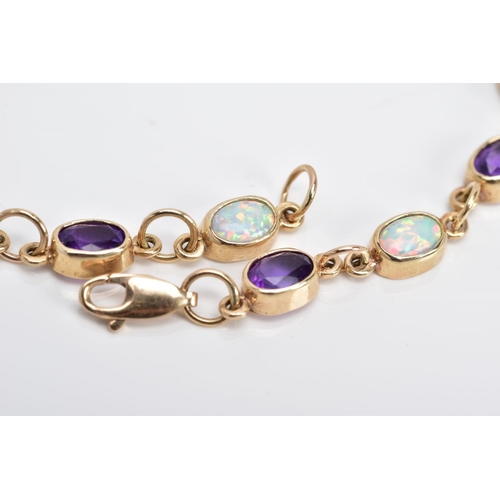 15 - A 9CT GOLD LINE BRACELET, designed with twelve oval links set with six oval cut amethyst and six ova... 