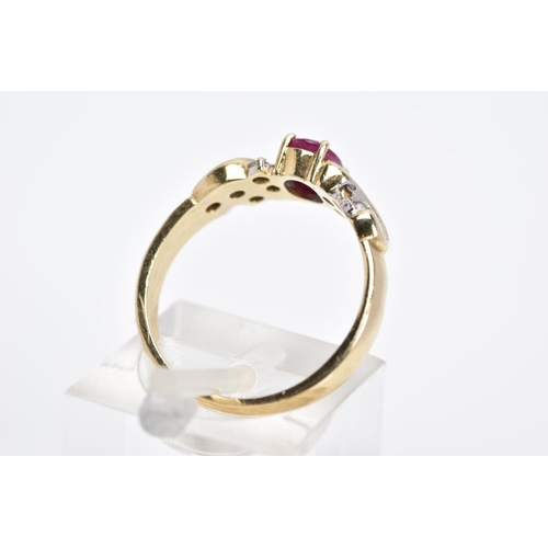 16 - A 9CT GOLD RUBY AND DIAMOND RING, designed with a central oval cut ruby flanked with round brilliant... 