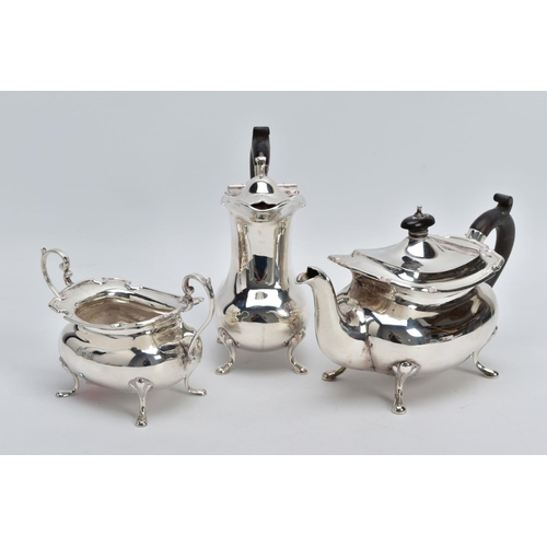 2 - A GEORGE V THREE PIECE SILVER TEA SERVICE SET, to include a teapot and coffee pot each with a plain ... 