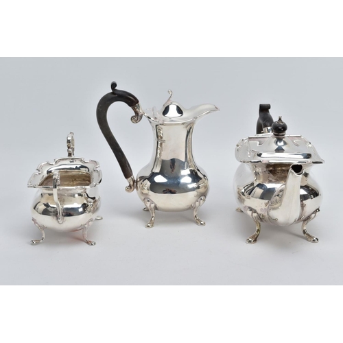 2 - A GEORGE V THREE PIECE SILVER TEA SERVICE SET, to include a teapot and coffee pot each with a plain ... 