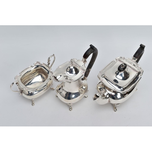 2 - A GEORGE V THREE PIECE SILVER TEA SERVICE SET, to include a teapot and coffee pot each with a plain ... 