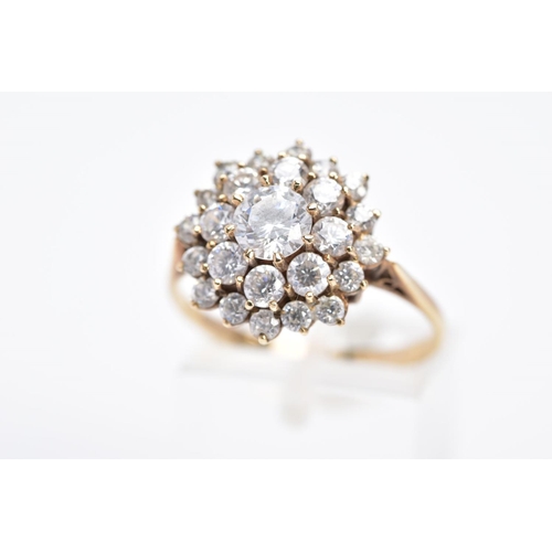 24 - A MODERN 9CT GOLD ROUND CLUSTER CUBIC ZIRCONIA RING, ring size R½, hallmarked 9ct gold, approximate ... 