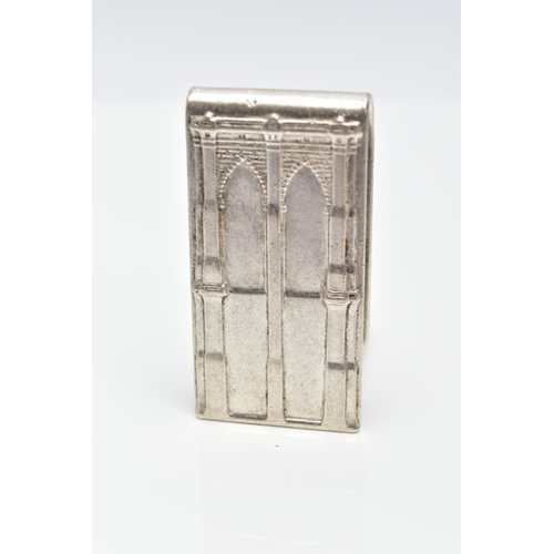 31 - A WHITE METAL MONEY CLIP, designed with a motif of two brick and pillar arches, approximate length 4... 