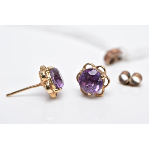 34 - A PAIR OF 9CT GOLD AMETHYST EARRINGS, each designed with a central circular cut amethyst within an o... 