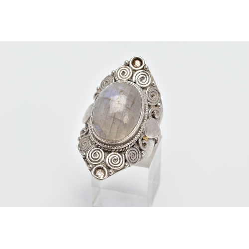 37 - A LARGE LABRADORITE CABOCHON RING, designed with a central oval labradorite cabochon within a beaded... 