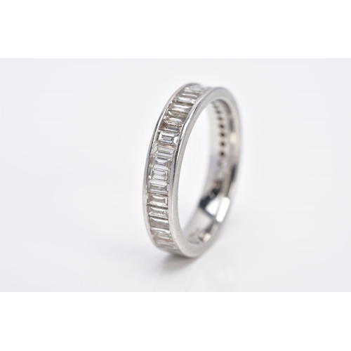 4 - A PLATINUM THREE QUARTER DIAMOND ETERNITY RING, set with a row of rectangular cut diamonds, total es... 