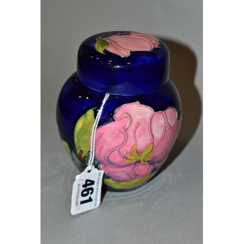 461 - A MOORCROFT GINGER JAR AND COVER, dark blue ground with pink magnolia, impressed marks, height 11cm