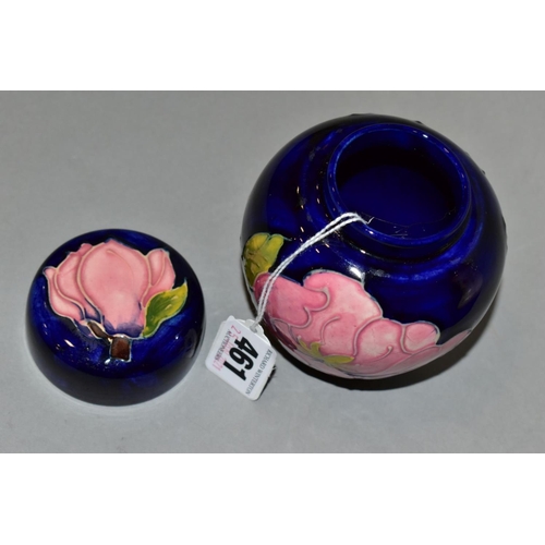 461 - A MOORCROFT GINGER JAR AND COVER, dark blue ground with pink magnolia, impressed marks, height 11cm