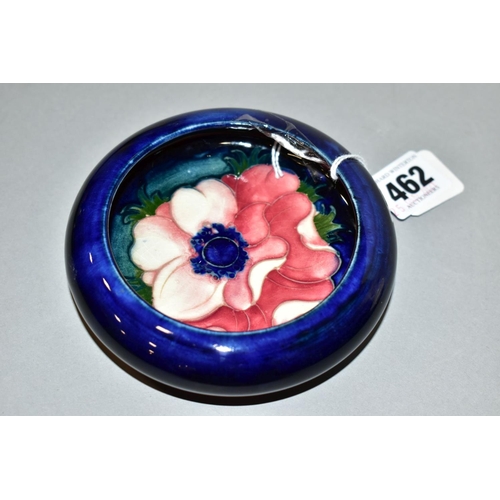 462 - A MOORCROFT POTTERY SHALLOW SHOULDERED BOWL, dark blue ground with pink/red anemone, impressed mark,... 