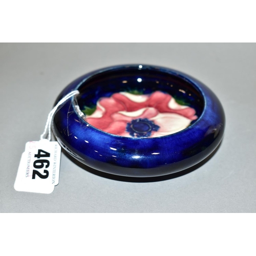 462 - A MOORCROFT POTTERY SHALLOW SHOULDERED BOWL, dark blue ground with pink/red anemone, impressed mark,... 