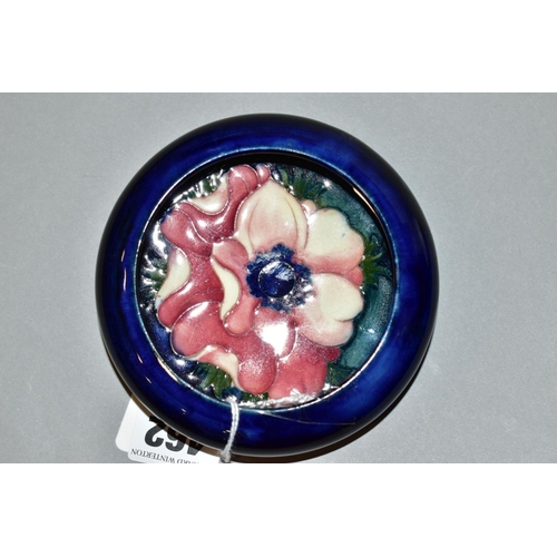 462 - A MOORCROFT POTTERY SHALLOW SHOULDERED BOWL, dark blue ground with pink/red anemone, impressed mark,... 