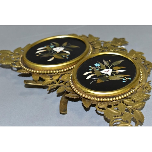 479 - A VICTORIAN GILT METAL AND PIETRA DURA MOUNTED PHOTOGRAPH FRAME, the oval floral panels set within b... 