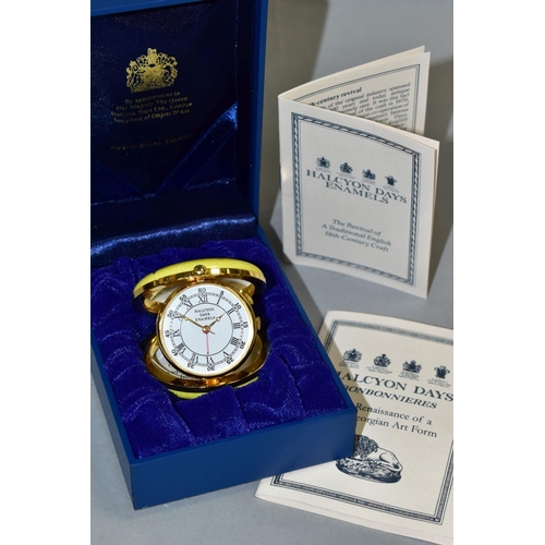 483 - A HALCYON DAYS ENAMELLED QUARTZ TRAVELLING ALARM CLOCK, together with box, diameter approximately 4.... 