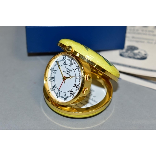 483 - A HALCYON DAYS ENAMELLED QUARTZ TRAVELLING ALARM CLOCK, together with box, diameter approximately 4.... 