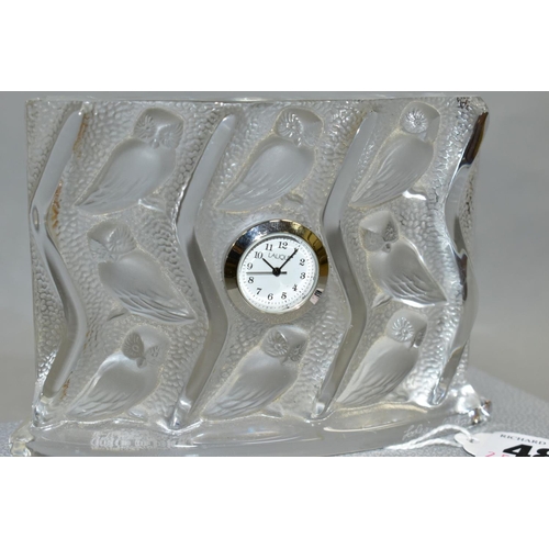 486 - A LALIQUE HULOTTE QUARTZ CLOCK, the bas relief style decoration features a repeat pattern of owls in... 