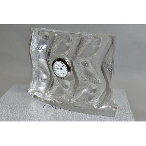 486 - A LALIQUE HULOTTE QUARTZ CLOCK, the bas relief style decoration features a repeat pattern of owls in... 