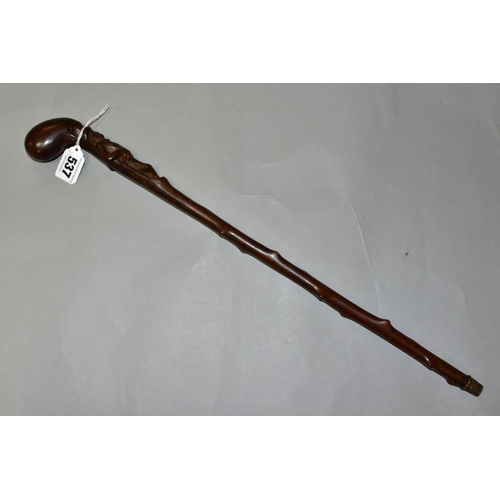 537 - A LATE 19TH/EARLY 20TH CENTURY CLUB HANDLED SHORT THORN STICK, carved below the handle with a man st... 