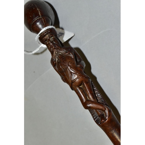 537 - A LATE 19TH/EARLY 20TH CENTURY CLUB HANDLED SHORT THORN STICK, carved below the handle with a man st... 