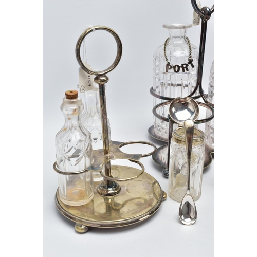 61 - A CUT GLASS THREE BOTTLE DECANTER STAND AND CRUET SET, the white metal decanter set with three cut g... 