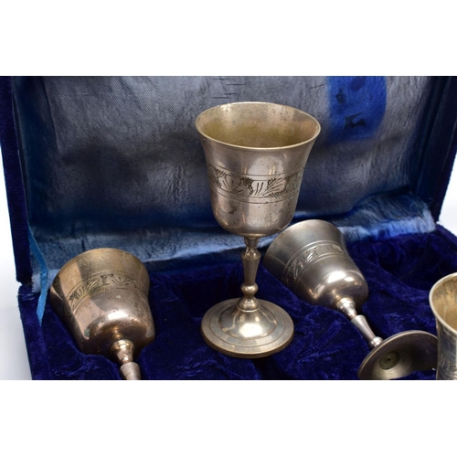 75 - THREE CASED SETS OF WINE AND BRANDY METAL GOBLETS, assorted design each engraved in a foliate and fl... 