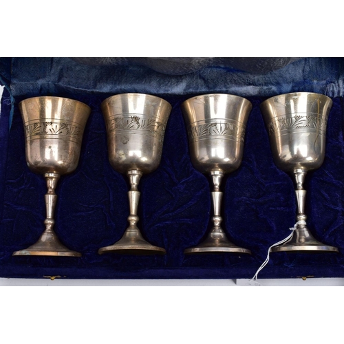 75 - THREE CASED SETS OF WINE AND BRANDY METAL GOBLETS, assorted design each engraved in a foliate and fl... 