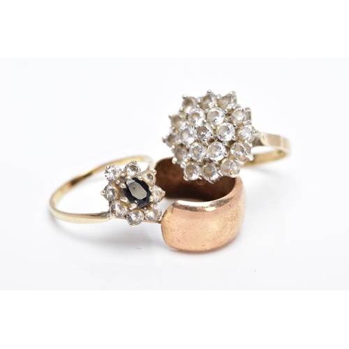 10 - TWO 9CT GOLD RINGS AND A SINGLE HOOP EARRING, the first ring designed as a large cluster set with ci... 