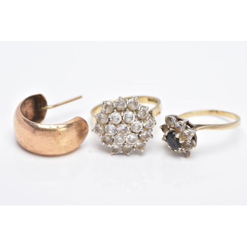 10 - TWO 9CT GOLD RINGS AND A SINGLE HOOP EARRING, the first ring designed as a large cluster set with ci... 