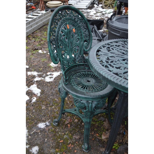 1006 - A PAINTED PLASTIC CIRCULAR GARDEN TABLE ( 68cm in diameter) and two chairs (3)