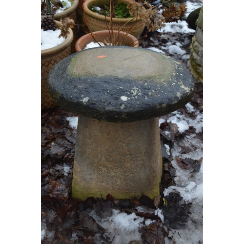 1010 - TWO COMPOSITE STADDLE STONES with tops 48cm high (2)