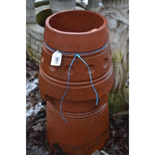 1011 - A TERRACOTTA CHIMNEY POT 65cm high, a Composite birdbath with three ladies forming the base and a ro... 