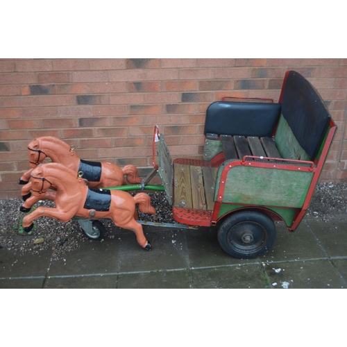 1021 - AN ORNAMENTAL DUAL HORSE AND CART with cast metal prancing horses 70cm long and buggy 87cm wide