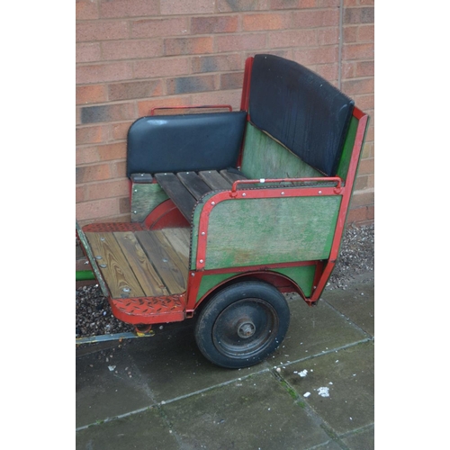 1021 - AN ORNAMENTAL DUAL HORSE AND CART with cast metal prancing horses 70cm long and buggy 87cm wide