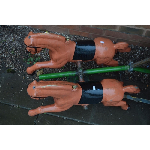 1021 - AN ORNAMENTAL DUAL HORSE AND CART with cast metal prancing horses 70cm long and buggy 87cm wide