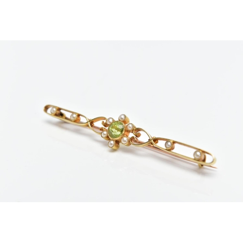 103 - A YELLOW METAL, PERIDOT AND SPLIT PEARL BROOCH, designed with a central circular cut collet set peri... 