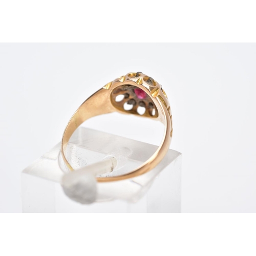 105 - A LATE VICTORIAN 18CT GOLD RUBY AND DIAMOND CLUSTER RING, designed with a central, circular cut ruby... 