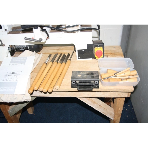 1065 - AN AXMINSTER APTC M330 WOOD LATHE total length 68cm with mandrill chuck, a set of six chisels and go... 